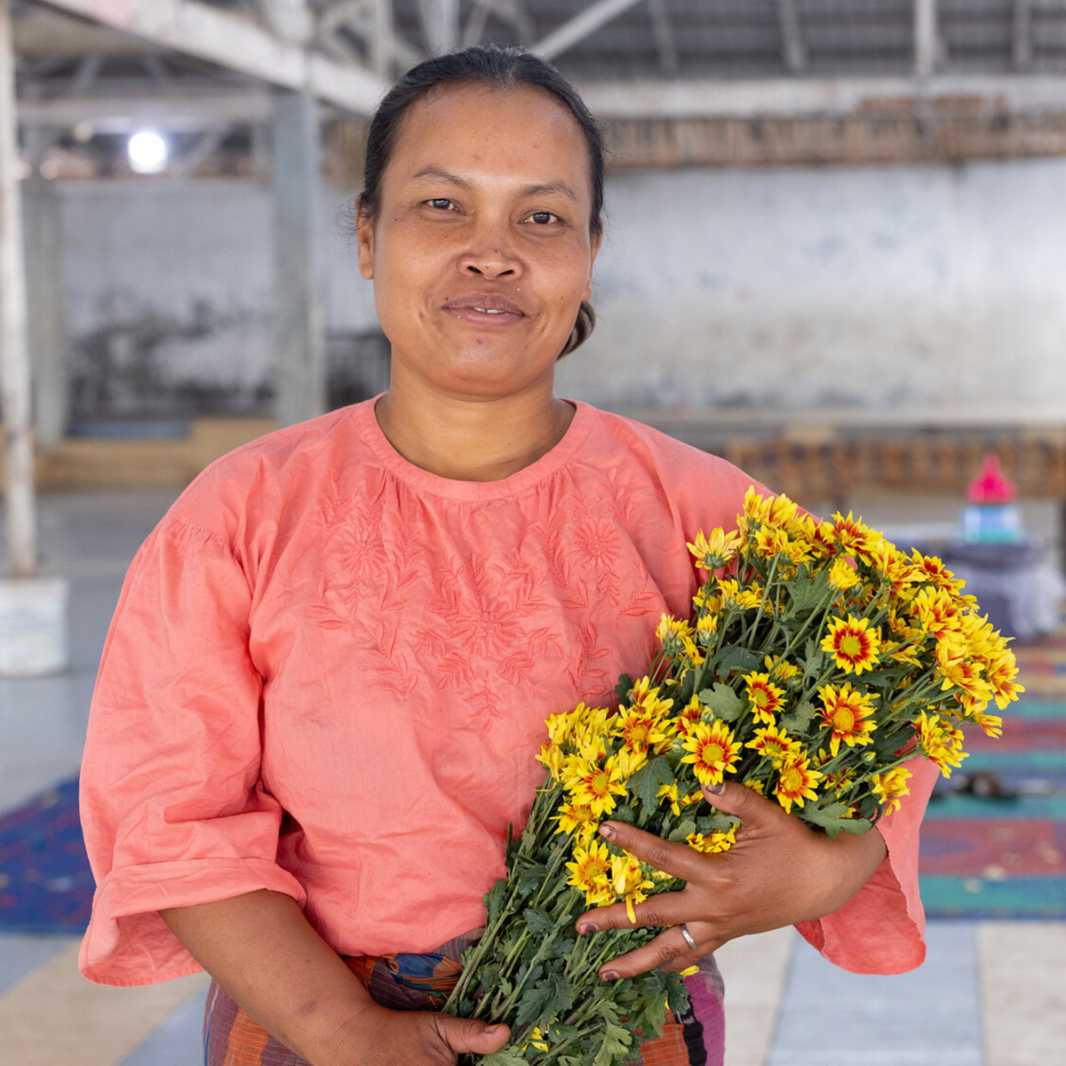 Temi with flowers from her farm.
